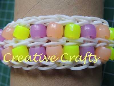 Como hacer una pulsera de gomitas con dos filas de abalorios. Rainbow Loom Bracelet beads.