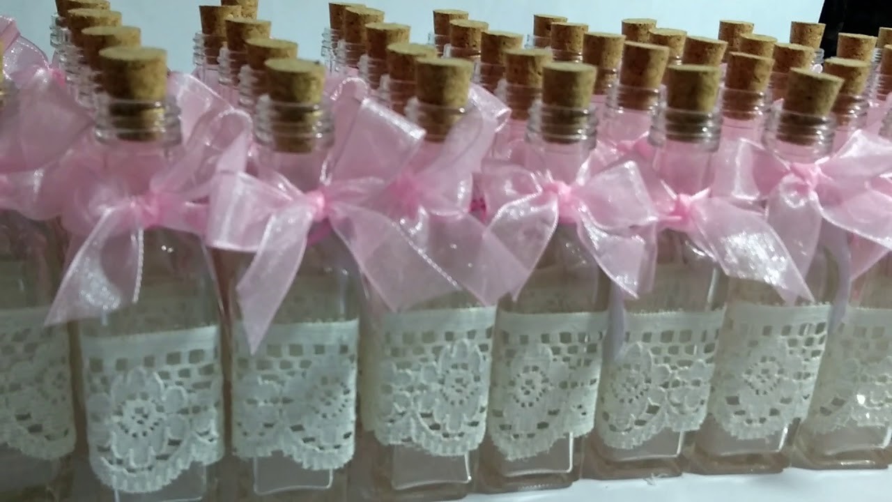 Botellas decoradas para recuerdo de bautizo