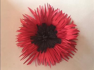 Flor hecha con trocitos de cartulina Flower made with pieces of paper