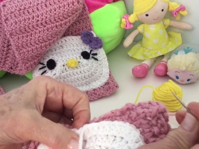 Como hacer bufanda de niña en crochet con bolsillos de Hello Kitty (paso 6de 6)