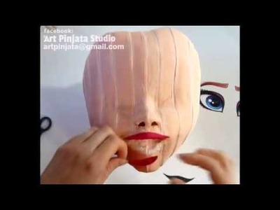 Art Pinata Studio - decorating Elsa's mouth and applaying eyes