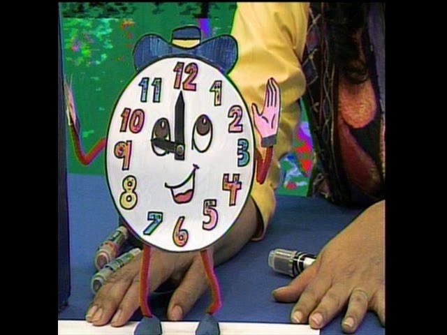 Carita simpática de reloj para niños en cuenticos.