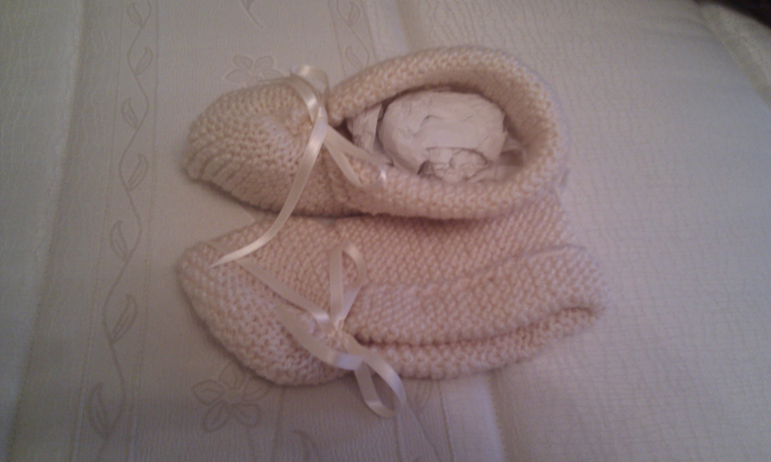 Pantuflas y patucos tricotados de lana