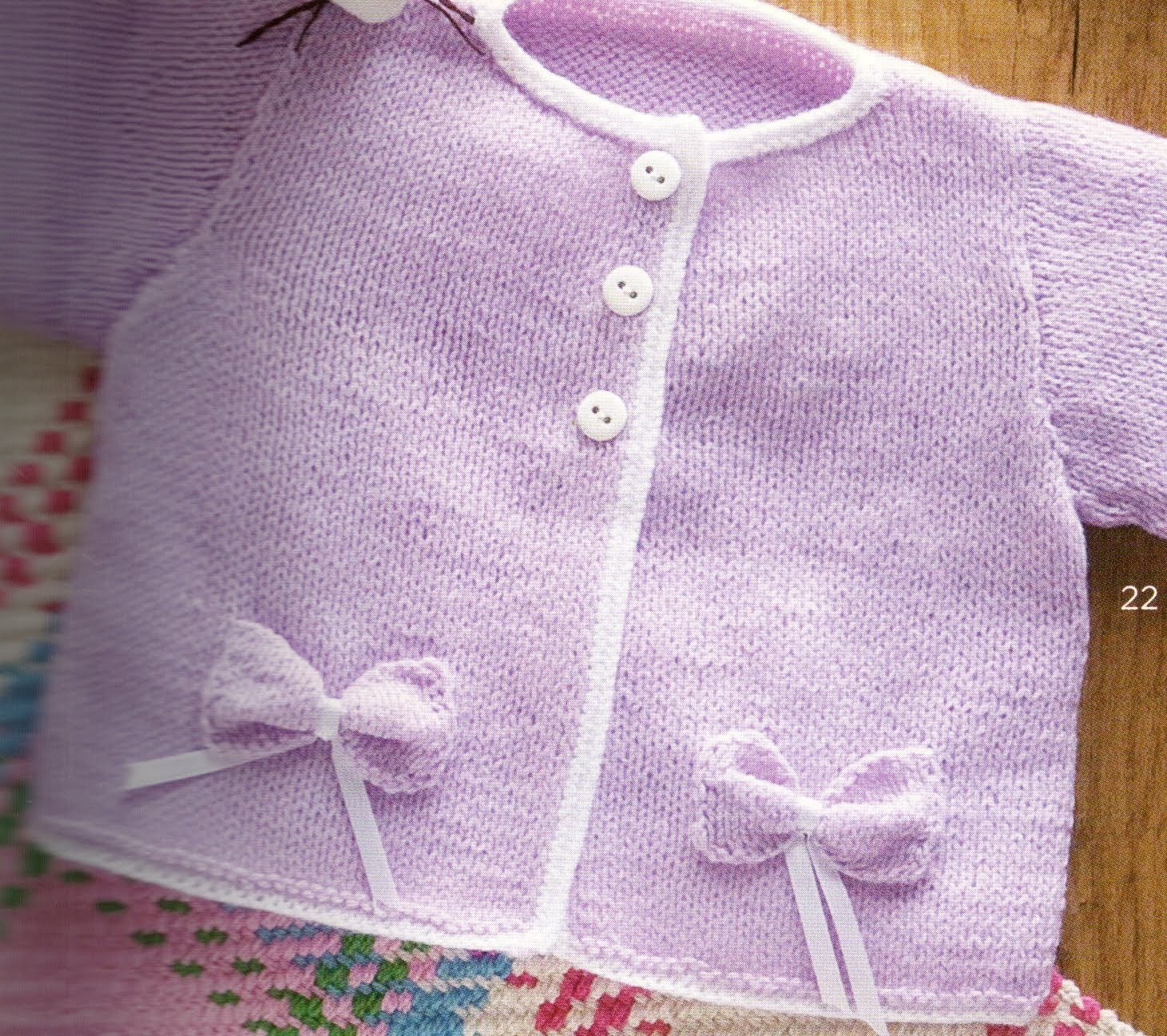Suéter con moños para niña bebé 2 agujas