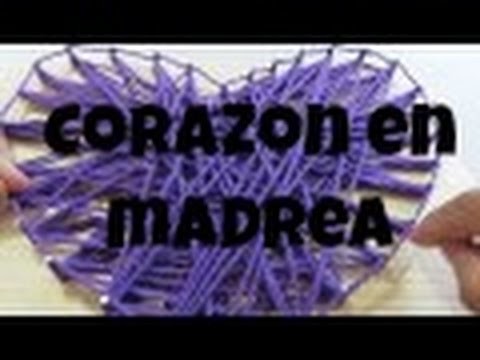 Corazon en madera decorado con hilo