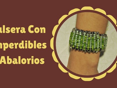 PULSERA CON IMPERDIBLES Y ABALORIOS