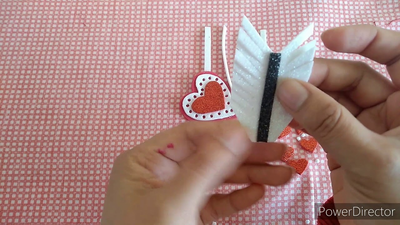 Flechas de cupido con un chocolate