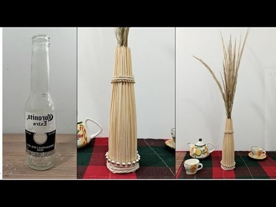Hermoso centro de mesa hecho de botella reciclada - manualidad con palos de pincho